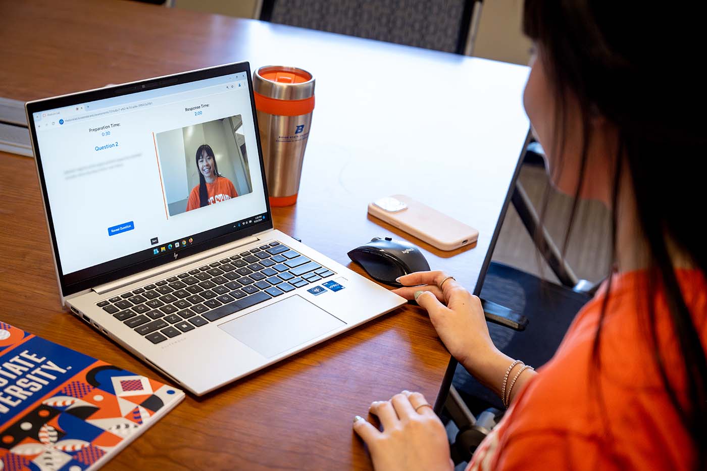 Instructor reviewing authentic video responses